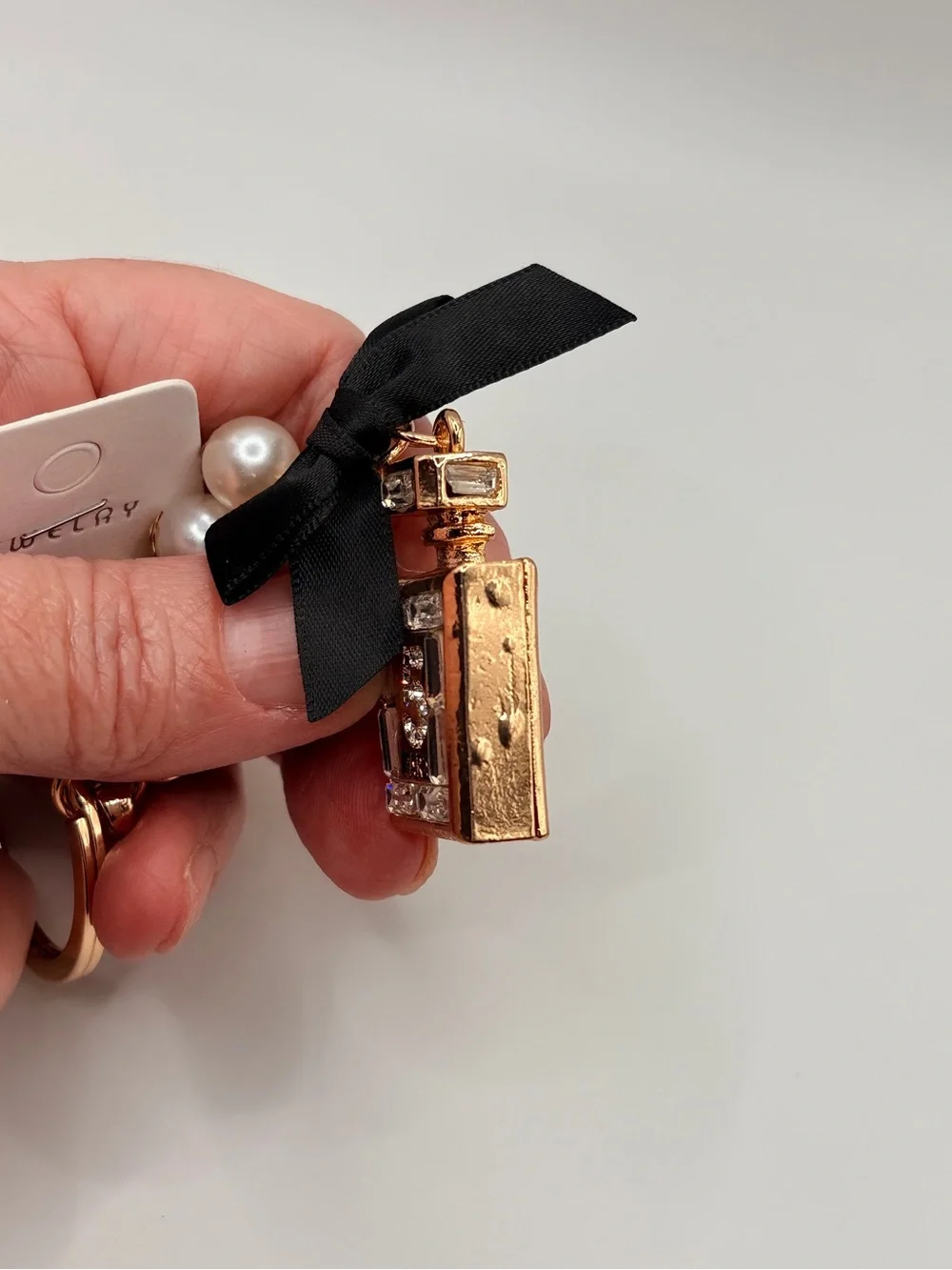 Gold Perfume Bottle Keychain with Black Bow and Pearls